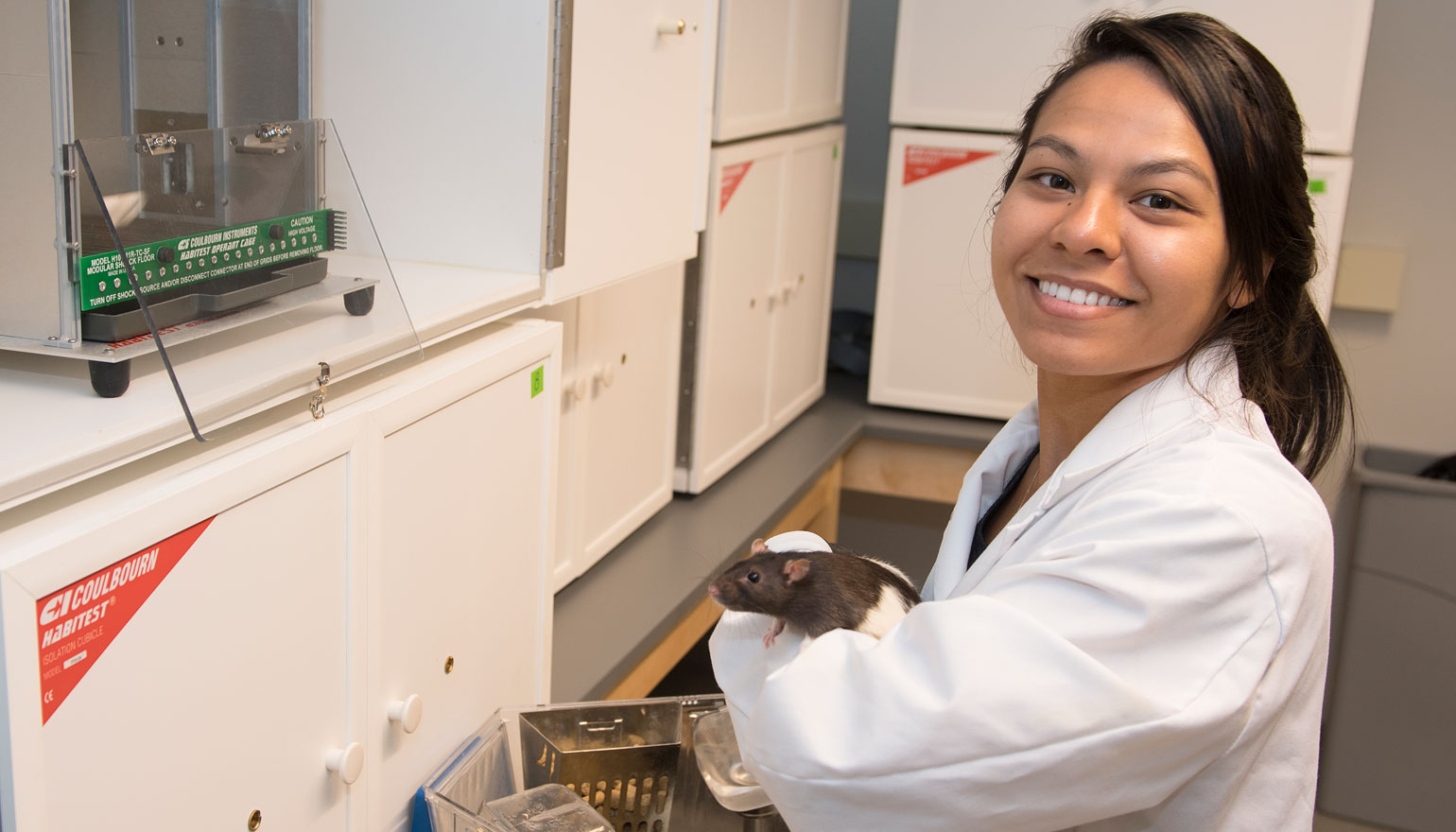 Student in Loyola's Rat Lab 