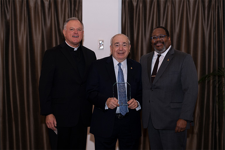 Rev. Penn Dawson, S.J., J.D.; 2025 Integritas Vitae Award recipient John Benedict "J.B." Cordaro '63; and President Xavier A. Cole, Ed.D.